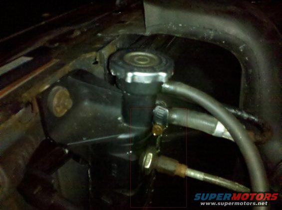 close-up of radiator cap and hoses