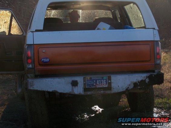 Orange and white Ford Bronco rear with an Indiana license plate