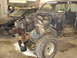 1993 Ford F-150 - A disassembled truck is in a garage, with a black car visible behind it.