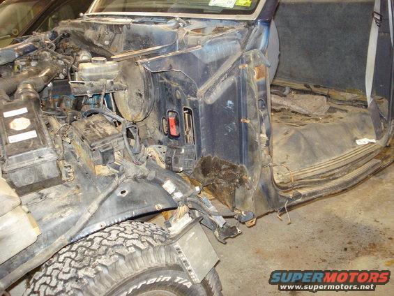 1993 Ford F-150 disassembled interior and engine bay, showing exposed wiring and engine components