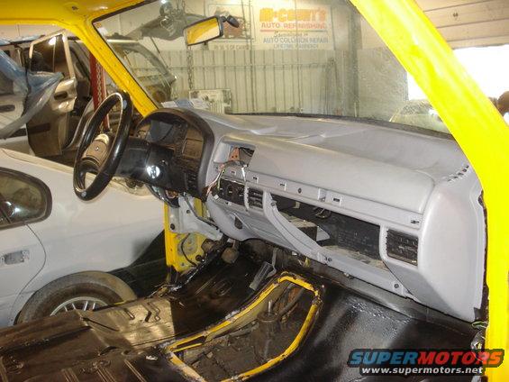 Interior of a yellow 1993 Ford F-150 during restoration
