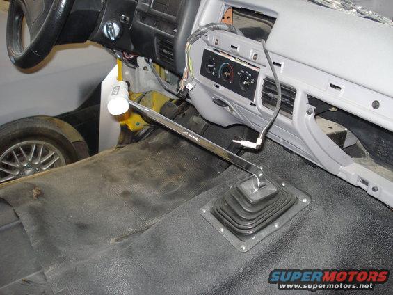 Interior shot of a 1993 Ford F-150 showing the dashboard, steering wheel, and manual transmission shifter