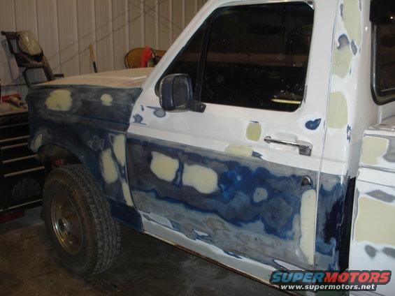 Ford truck door and fender with body filler and primer