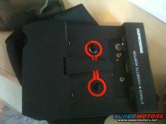 Sparkomatic 8-track to cassette tape adapter with red accents