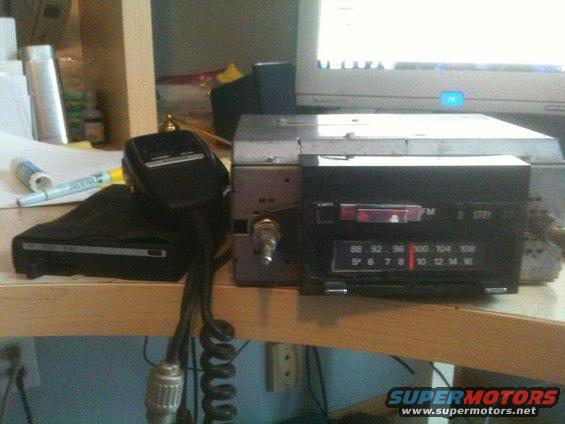 Car stereo with FM band and a microphone on a desk