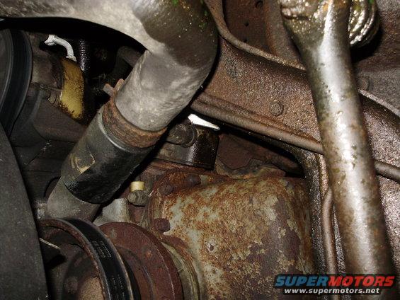 close-up of rusty engine parts and hoses