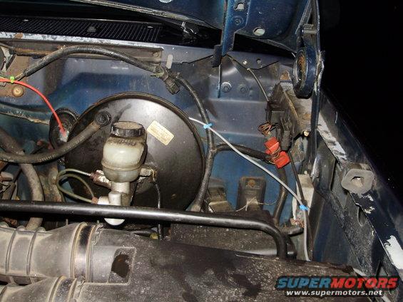 Engine bay view of brake booster and master cylinder