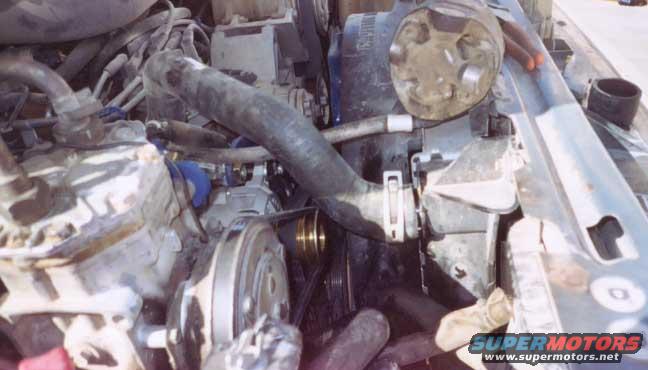 oba-belt-clearence2.jpg belt clearence after trimming radiator hose, you can see the piece i cut off on the rad suport