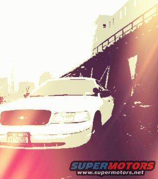 White 2000 Ford Crown Victoria, 3q-front view, with sun glare
