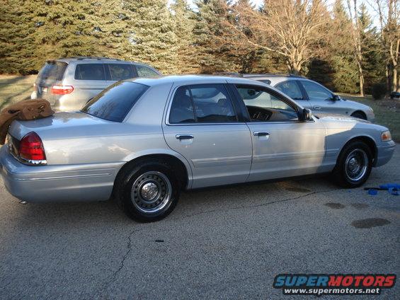 Silver 2000 Ford Crown Victoria sedan, side view