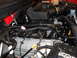 2011 Ford F-150 - The engine bay of a 2011 Ford F-150 shows Shelby Ford valve covers and various engine components.