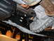 2011 Ford F-150 - The photo shows the underside of a truck, focusing on the transmission and exhaust system.