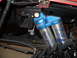 2011 Ford F-150 - Close-up of SVT branded Fox Racing shock absorbers, likely from an off-road vehicle.