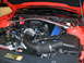 2012 Ford Mustang - Engine bay of a 2012 Ford Mustang, showing the V8 engine and intake system.