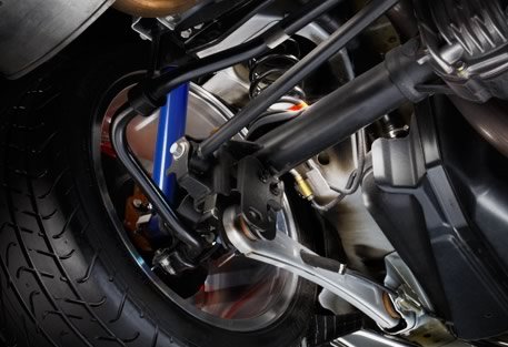 2012 Ford Mustang rear suspension with blue shock absorber and tire