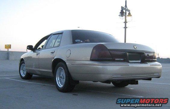 2000 Mercury Grand Marquis sedan, rear 3/4 view, parked in a lot