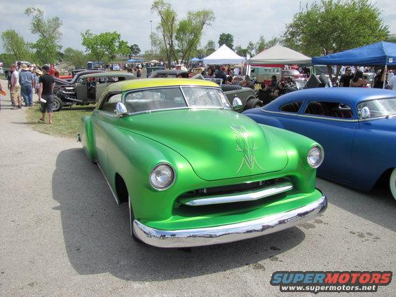 Green custom coupe with yellow roof and pinstriping, front view