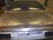 1971 Dodge Dart - Rear view of a 1971 Dodge Dart undergoing bodywork, showing the trunk lid and bumper area.
