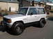 1987 Mazda RX-7 - This two-door SUV, identified by its "Raider" badge, is seen from a three-quarter front angle.
