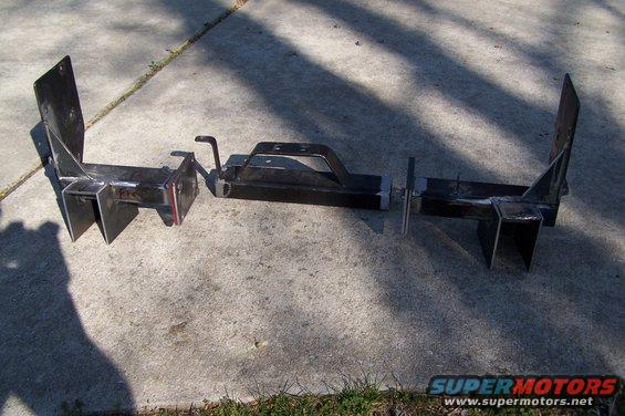 Custom trailer hitch receiver assembly laid out on concrete