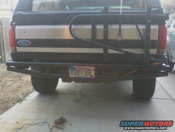 Rear view of a 1995 Ford Bronco with a custom bumper and spare tire carrier