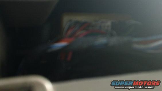 Close-up of colorful wires bundled together, possibly part of a vehicle's electrical system