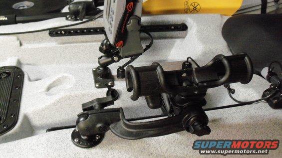 Kayak interior with fishing rod holders and fish finder mounted