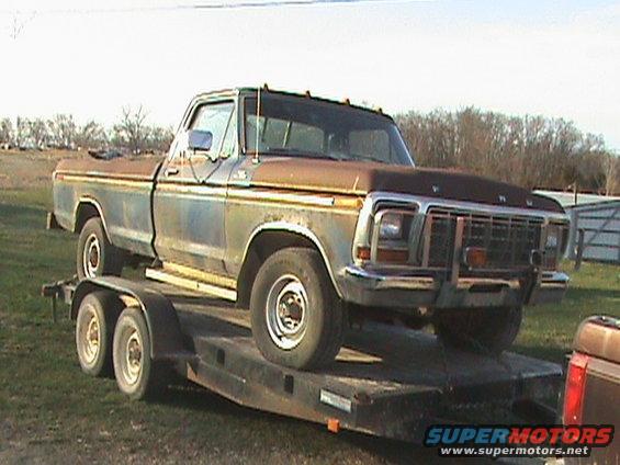 Old Ford pickup truck on a trailer, looks like a 1977 model