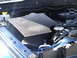 2005 Dodge 2500 - Close-up view of the engine compartment of a blue Dodge Ram 2500.