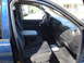 2005 Dodge 2500 - The interior of a blue Dodge Ram 2500 pickup truck is shown from the passenger side door.