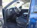 2005 Dodge 2500 - The interior of a blue Dodge Ram 2500 pickup truck is visible, with a focus on the driver's side seat and dashboard.