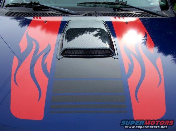 Blue vehicle hood with red flame decals and a black hood scoop
