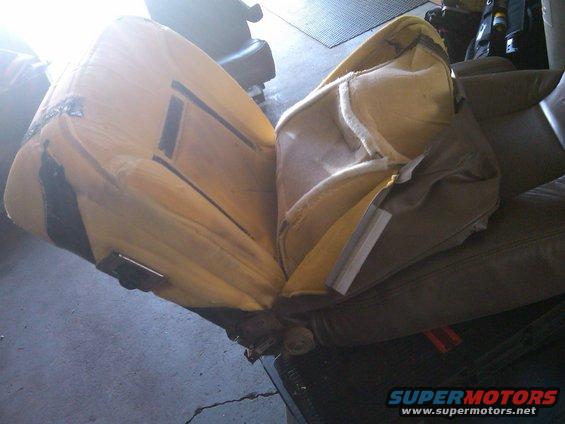 disassembled vehicle seat showing foam and internal structure