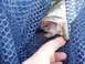 1993 Tracker Tournament - A fish is held by a finger inside a blue net, with a website URL visible at the bottom right.