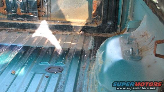 Interior cargo area with ribbed floor and teal paint