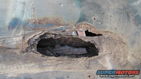 Rust spot on passenger side near tailgate