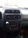 2004 Nissan Xterra - Interior view of a 2004 Nissan Xterra dashboard, showing the center console with climate controls and radio.