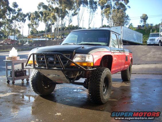1992 Ford Ranger pickup truck modified for off-road use with a large front bumper and lifted suspension