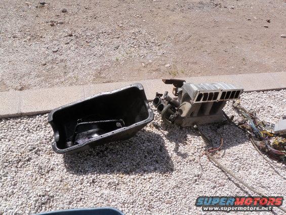Engine intake manifold and oil pan on gravel