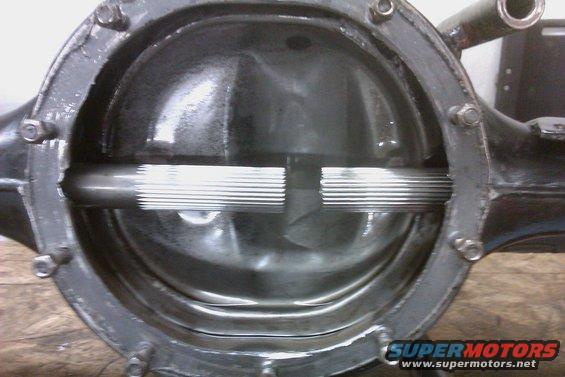 Differential housing with splined axle shafts visible