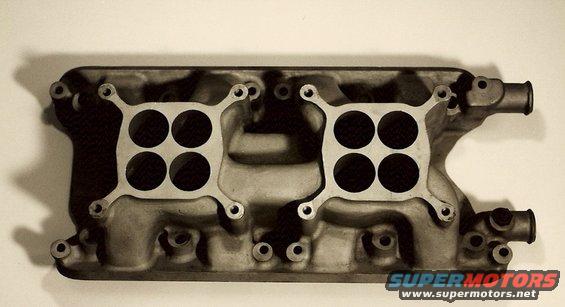 Dual quad intake manifold with four carburetor mounting holes on each side