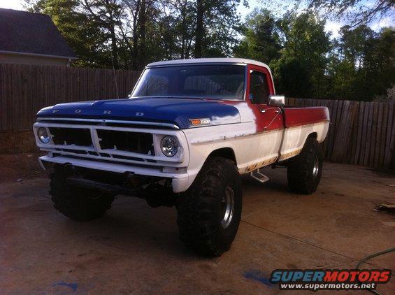 Ford pickup truck with custom paint and large tires