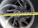 1996 Ford Bronco - A yellow measuring tape is placed across a vehicle's wheel hub, showing measurements from 11 to 25 inches.