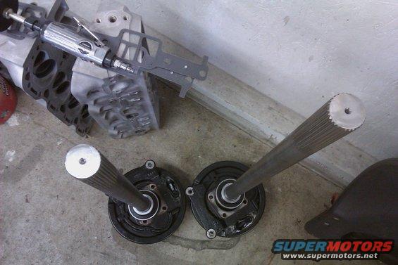 Axle shafts and brake assemblies with a rotary tool on engine parts