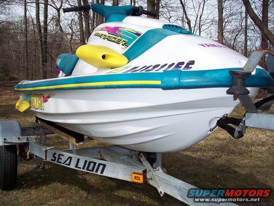1996 Yamaha RA760 WaveRaider 2-P jet ski on a trailer, white with teal and yellow accents