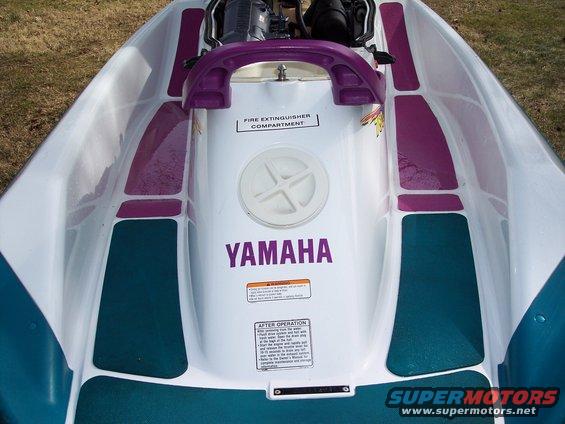 Yamaha jet ski interior with purple accents and a warning label