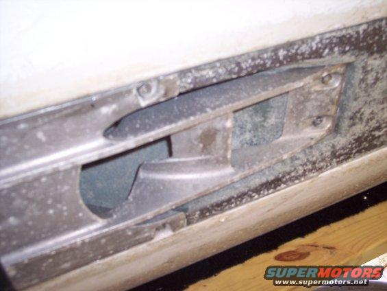 Close-up of a metal component with a cutout, part of a personal watercraft hull