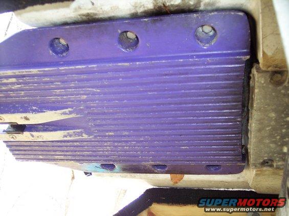 Close-up of a purple jet ski intake grate with horizontal ridges and bolt holes
