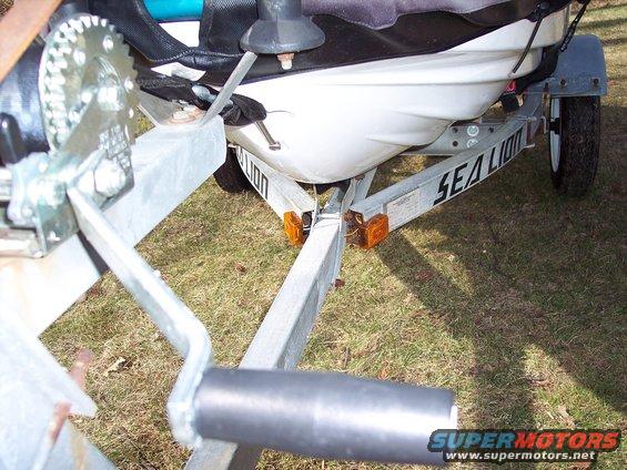 Jet ski on a Sea Lion trailer with a winch mechanism visible