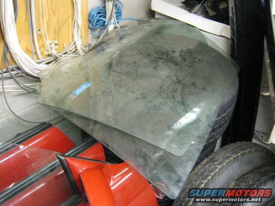 img_1673.jpg Sedan glass. Right rear and left front loose from doors.